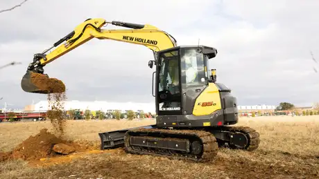 E85D digging in field.