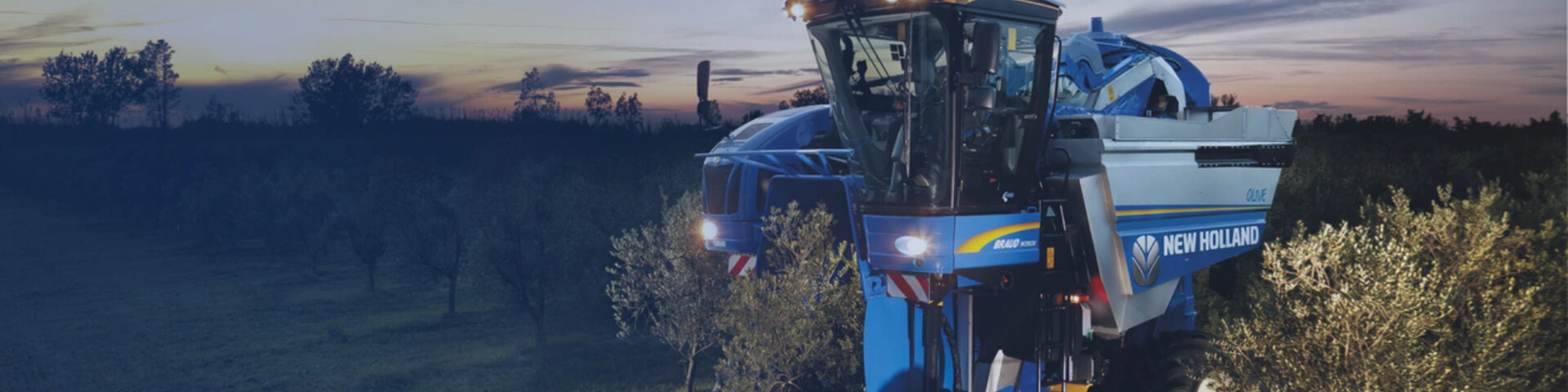 New Holland Grape Braud Harvester working in field