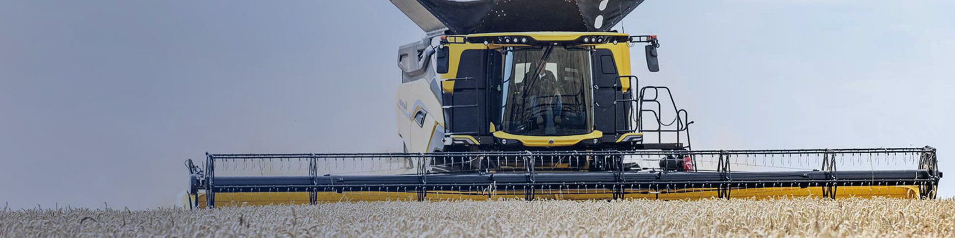 New Holland Varifeed combine header working in field