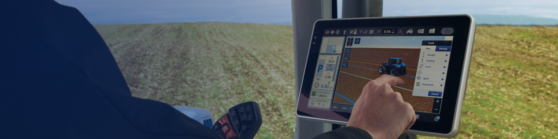 New Holland operator touching in cab display