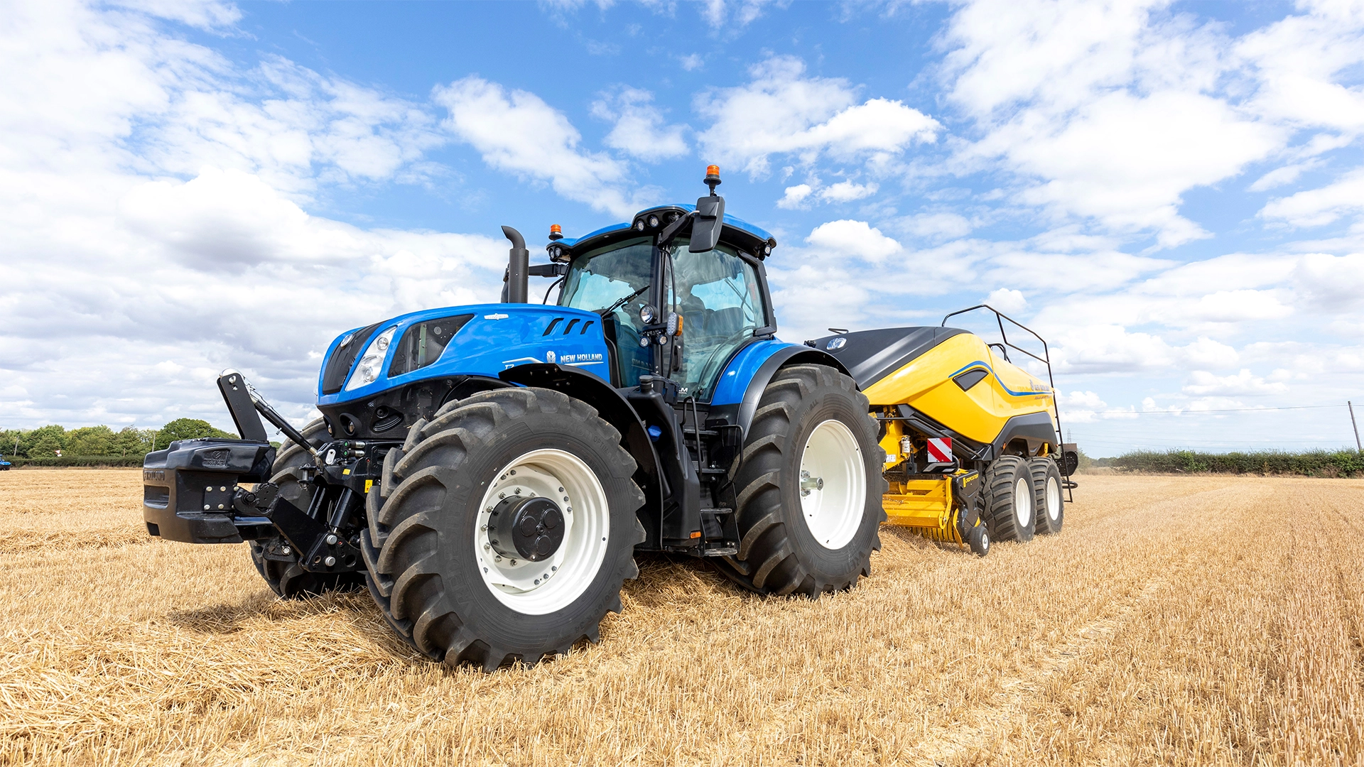 T7 Heavy Duty With PLM Intelligence Tractor efficiently operating in a farming environment