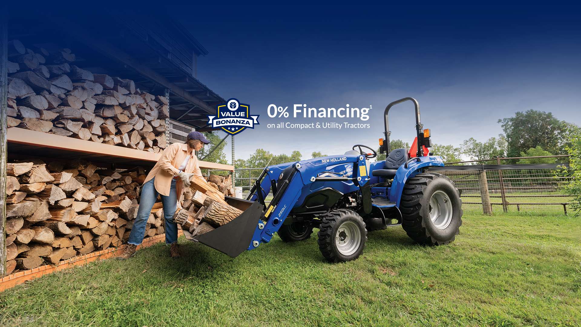 Woman loads firewood into tractor bucket.