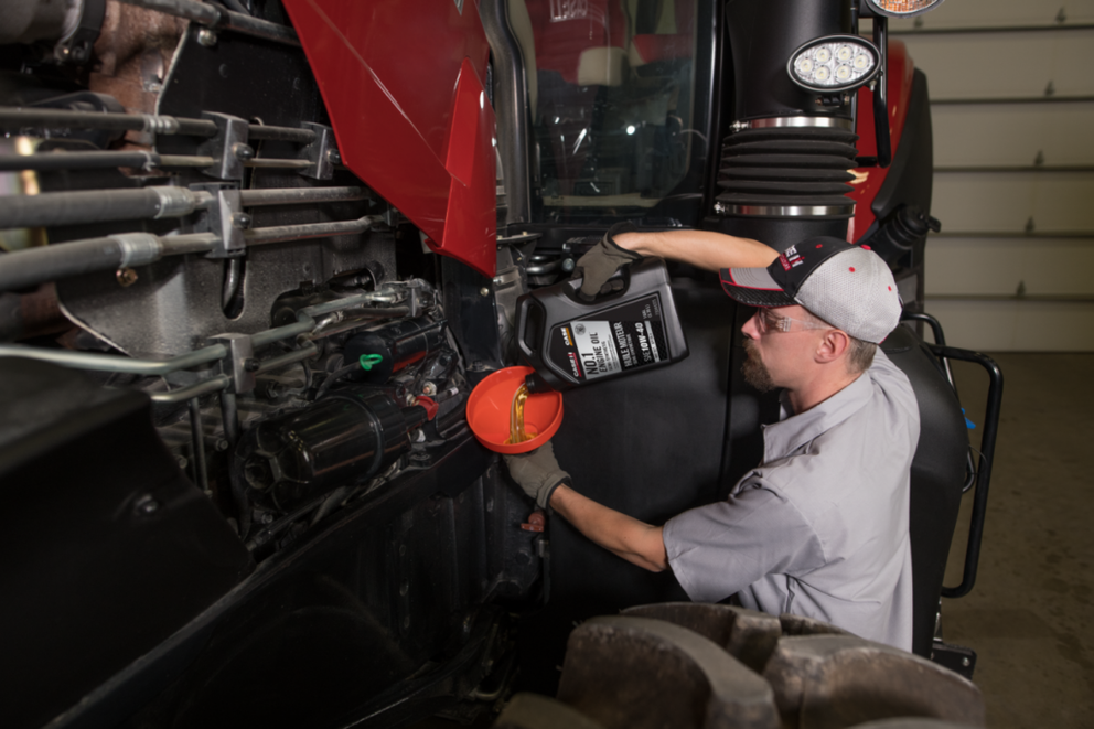 technician changing oil