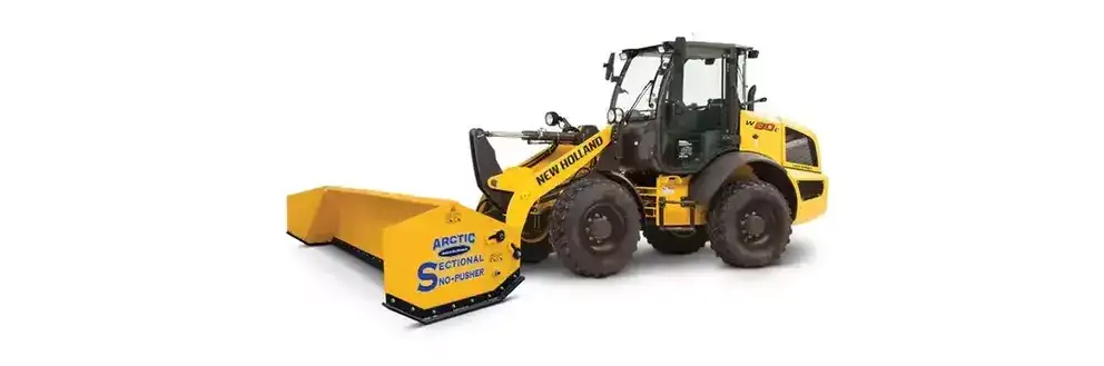 Arctic Sectional Snow Pusher attached to New Holland Construction W80C Compact Wheel Loader