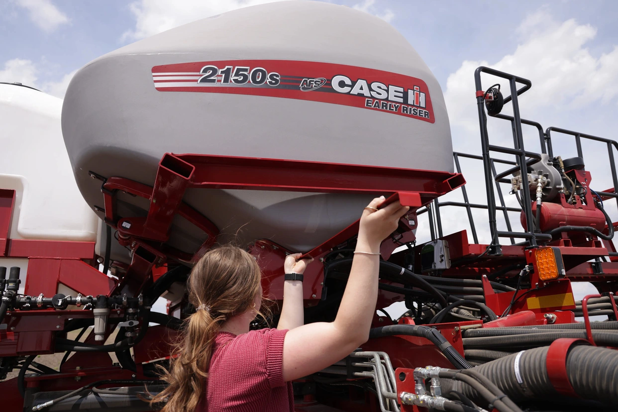 Case IH technician adjusting hopper on 2150s early riser planter