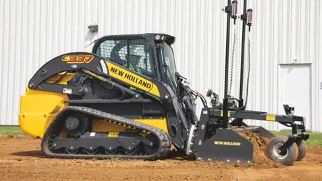New Holland Construction C337 with Laser Grader box attached.