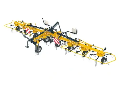 Proted tedder range product working in field, with New Holland tractor