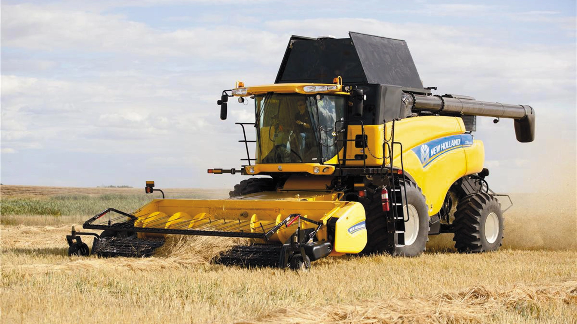 Agricultural field scene with New Holland combines utilising their Advanced Pick-Up Corn Header for optimal yield