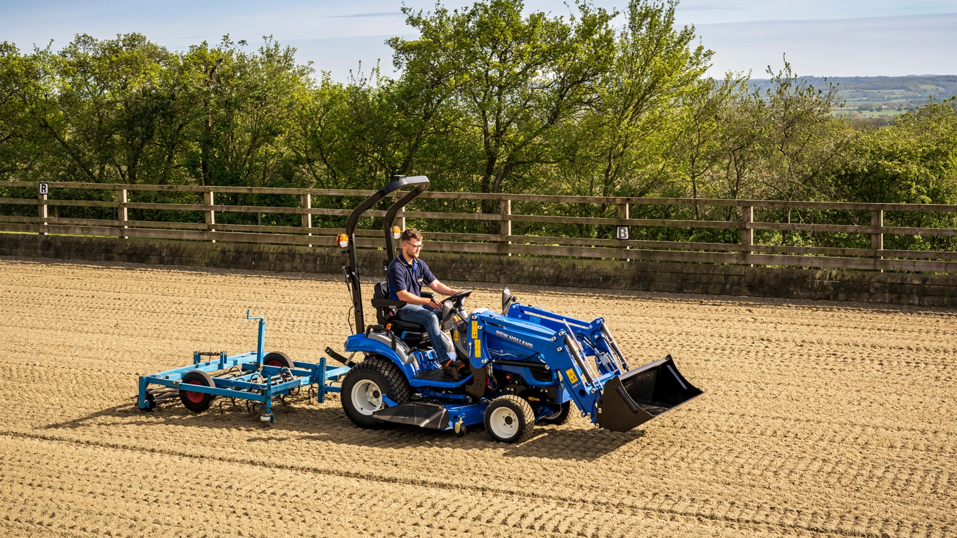 Boomer tractor by New Holland in action on farmland