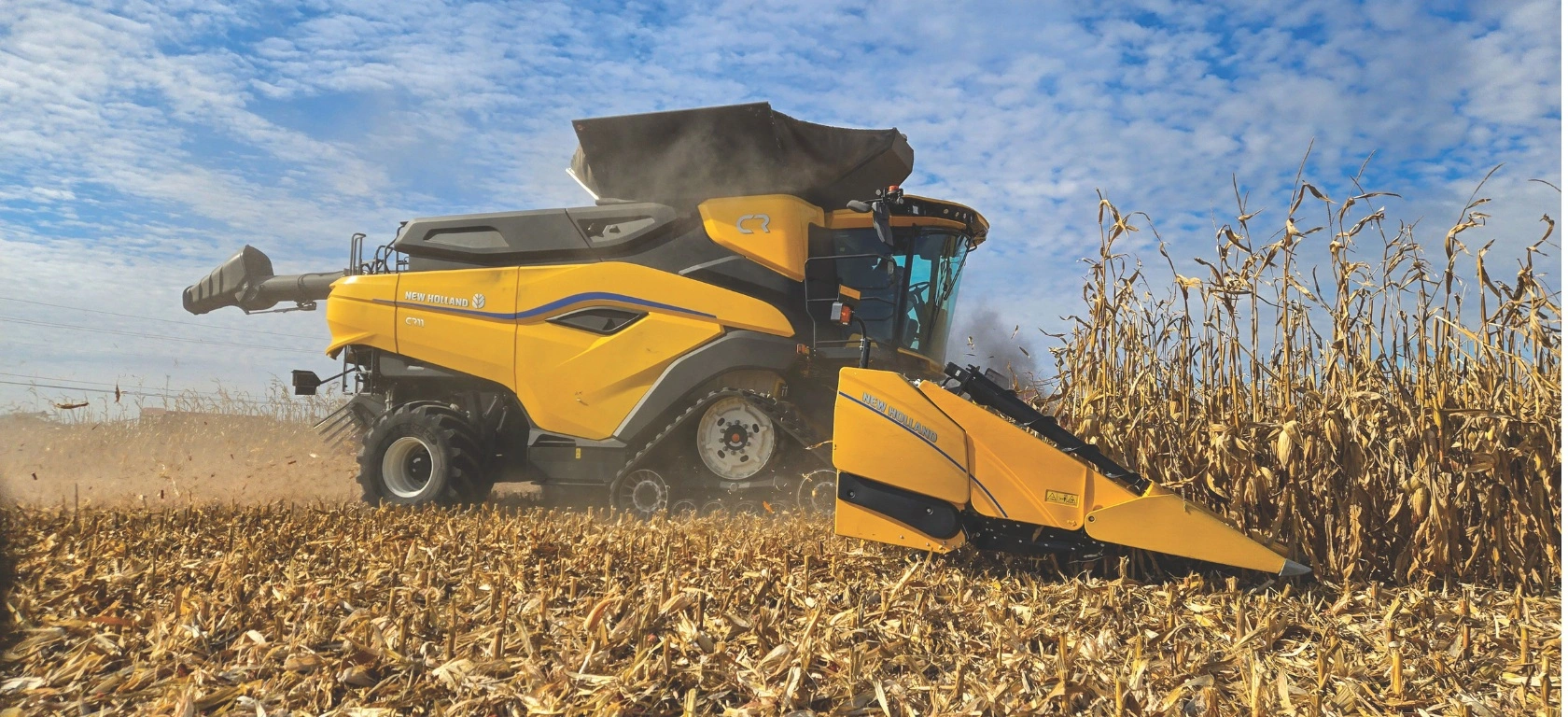 New Holland combine harvester and 9200 series corn head in the field