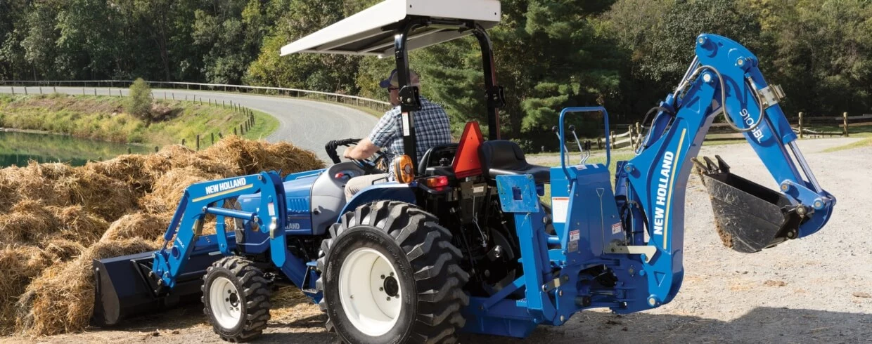 WORKMASTER compact tractor with loader and backhoe attachments