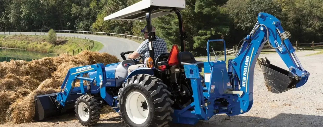 WORKMASTER compact tractor with loader and backhoe attachments