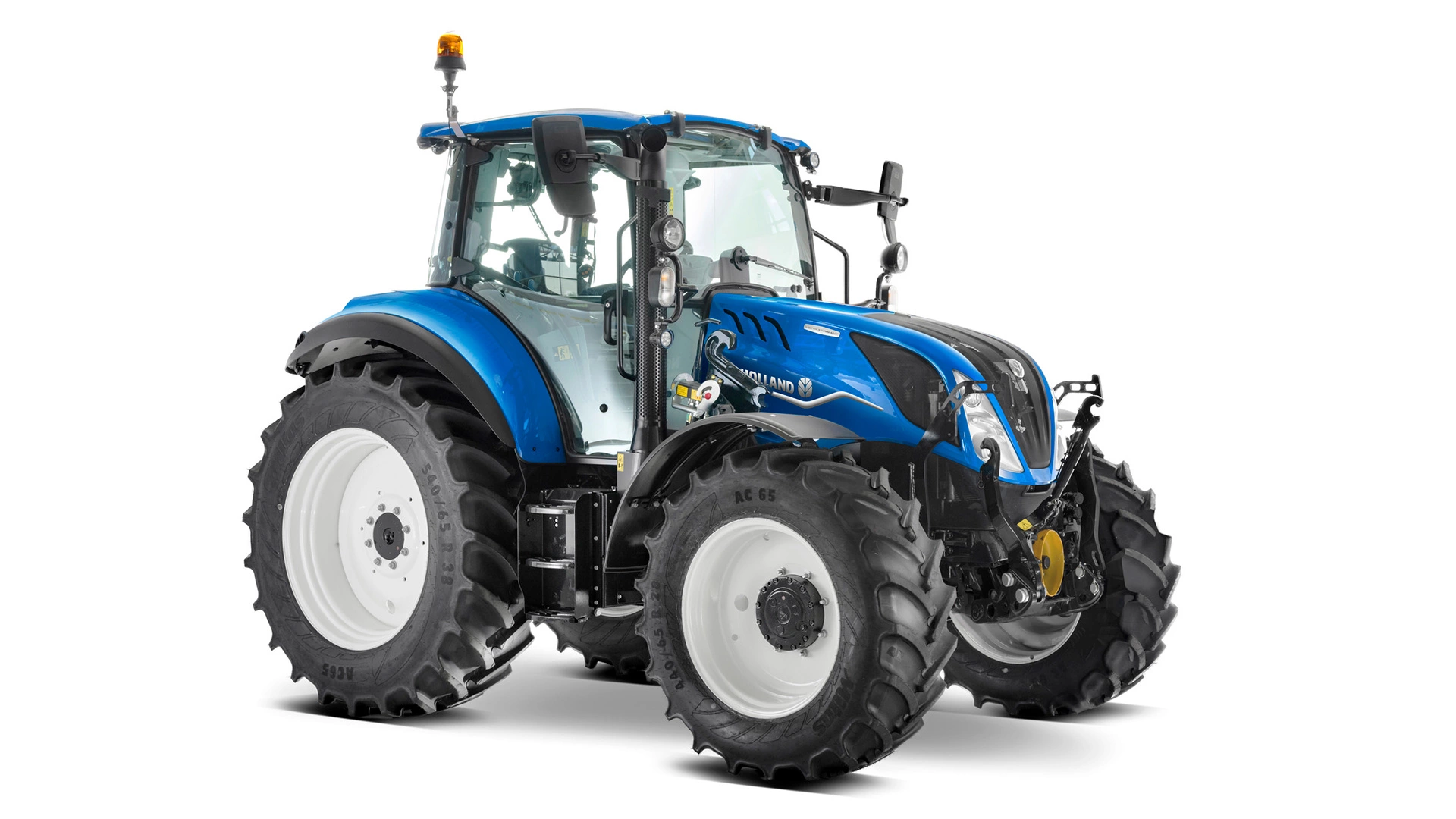 Farming tractor New Holland T5 Electro Command in action on agricultural land